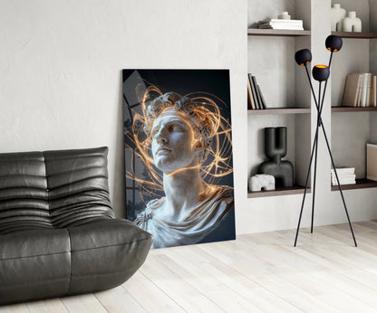 Modern living room with classical marble bust artwork featuring golden light effects, displayed leaning against white wall beside black leather chair and floor lamp.