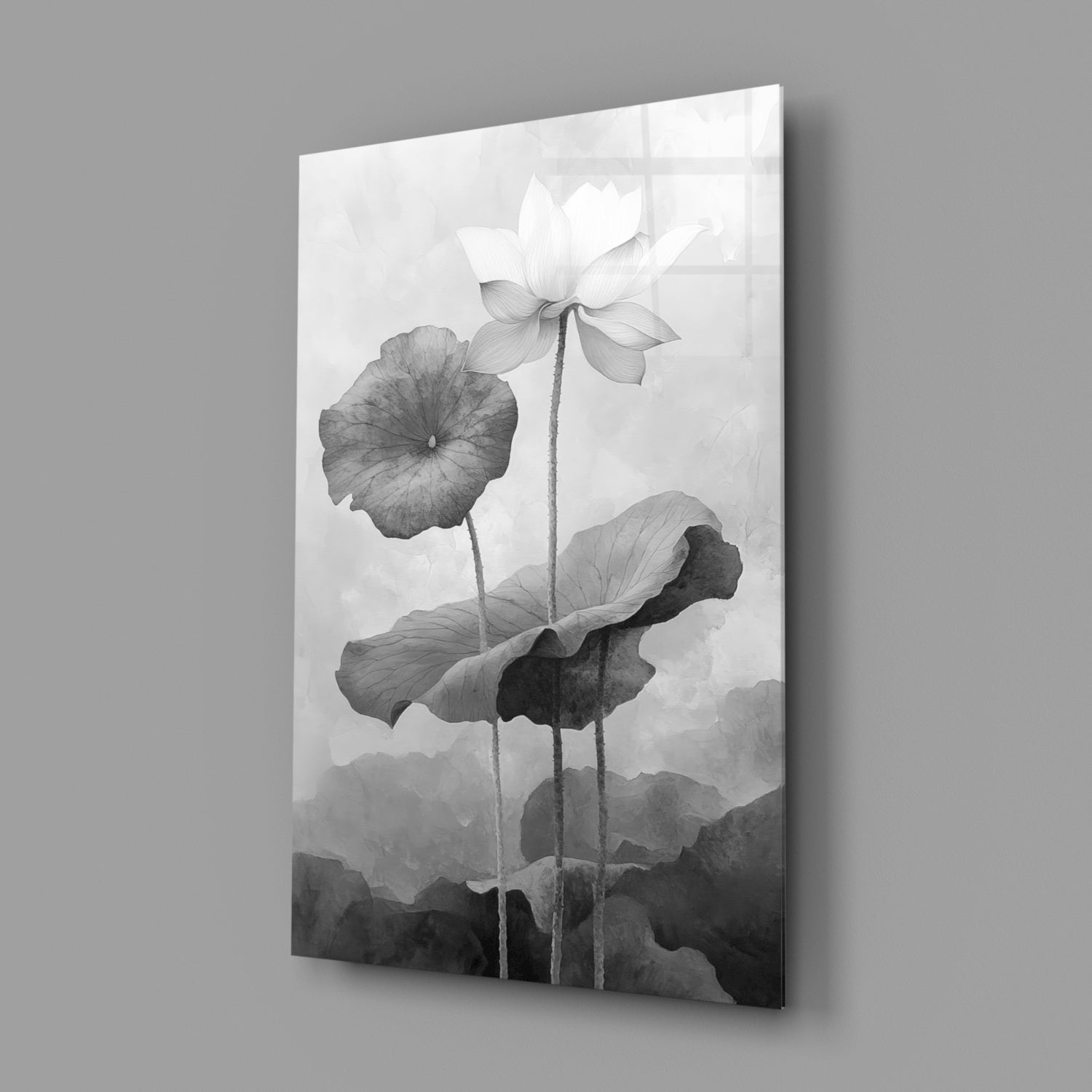Three water lilies with detailed leaves and stems rendered in black and white on a glass panel, displayed at an angle against a gray background.