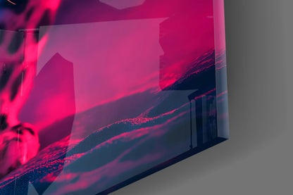 Close-up angled view of neon pink and deep blue glass wall art panel against gray background, showing layered translucent edges and vibrant color gradient.