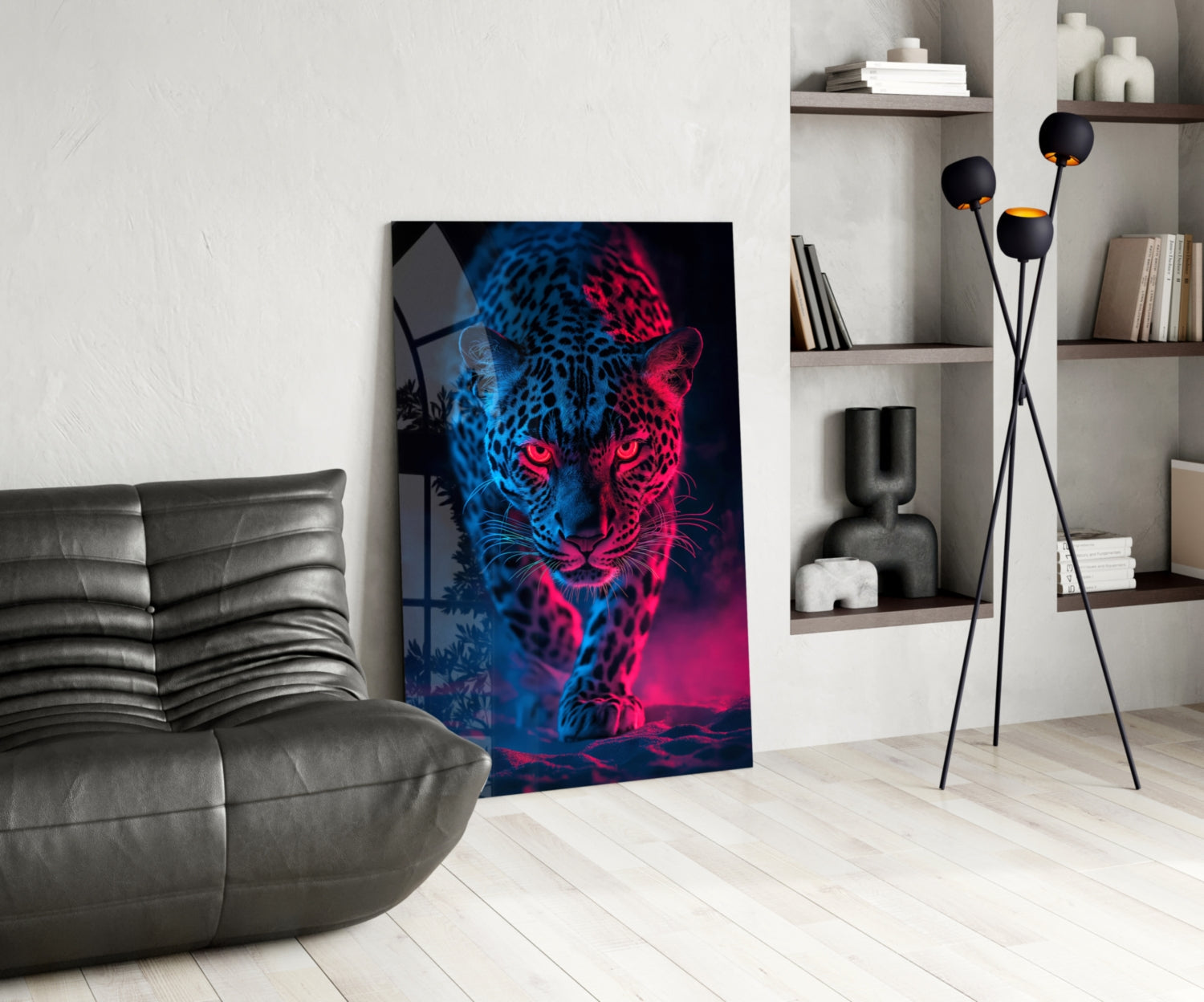 Neon leopard glass wall art leaning against white wall in modern living room with gray sofa and shelving.