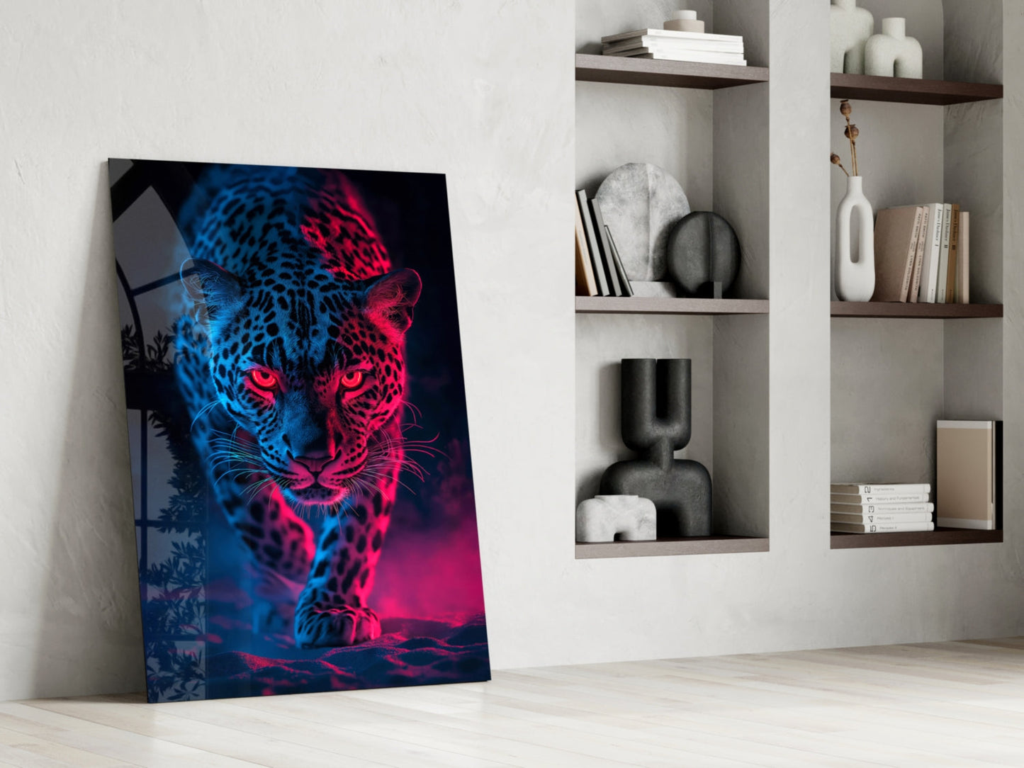 Neon leopard glass art leaning against wall beside white shelving with decorative objects and books.