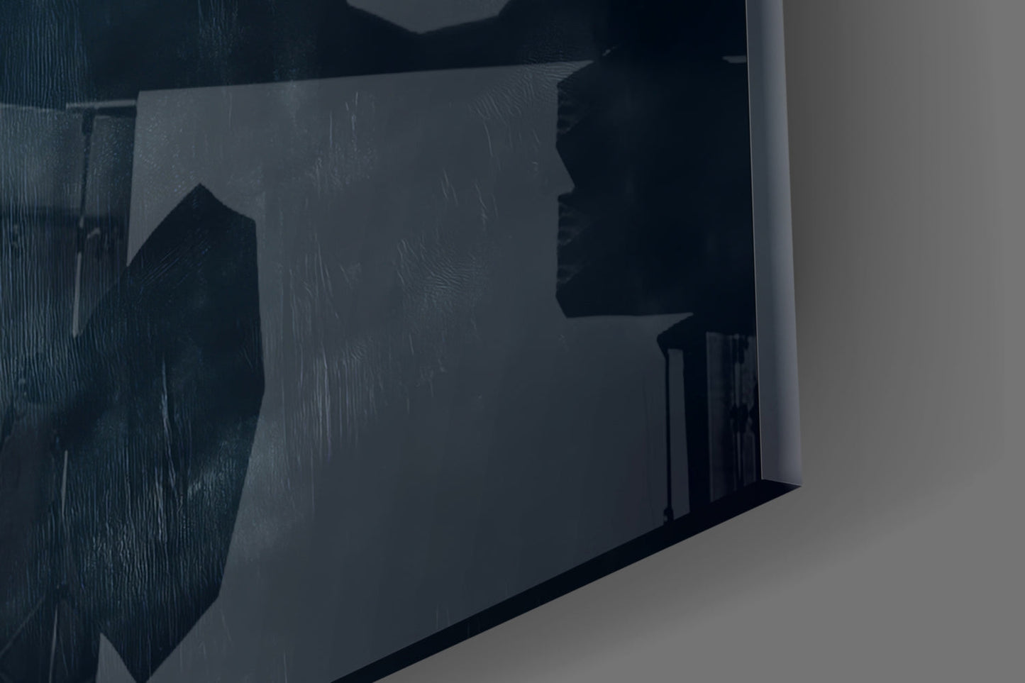 Close-up side angle of frosted glass wall art showing silhouetted landscape with buildings and rain texture detail.