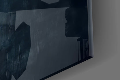 Close-up side angle of frosted glass wall art showing silhouetted landscape with buildings and rain texture detail.