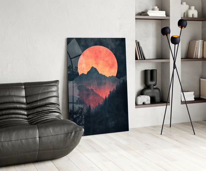 Modern living room interior featuring Red Moon Rising glass wall art leaning against white wall beside gray leather chair.