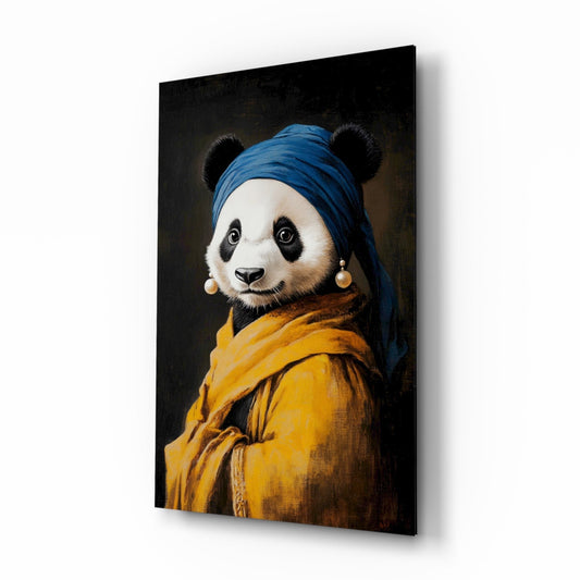 Three-quarter view of a glass wall art panel displaying a panda wearing a blue turban and yellow jacket with pearl earring, against a dark background.