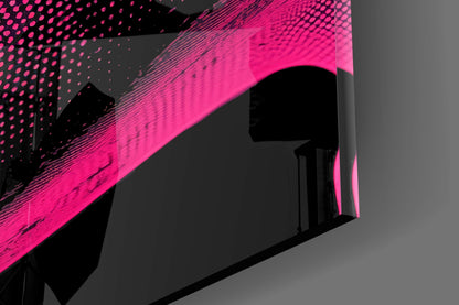Close-up angled view of bright pink glass wall art with black dotted and linear pattern details against gray background.