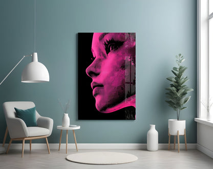 Pink and black halftone portrait artwork displayed on teal wall above modern chair in minimalist room setting.