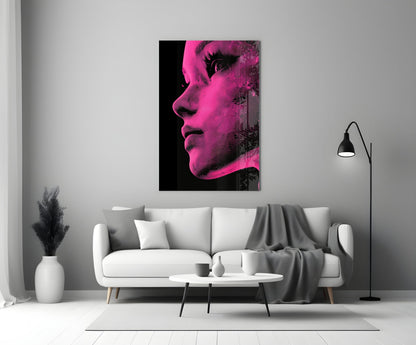 Pink and black halftone portrait glass wall art displayed above a white sofa in a modern living room.