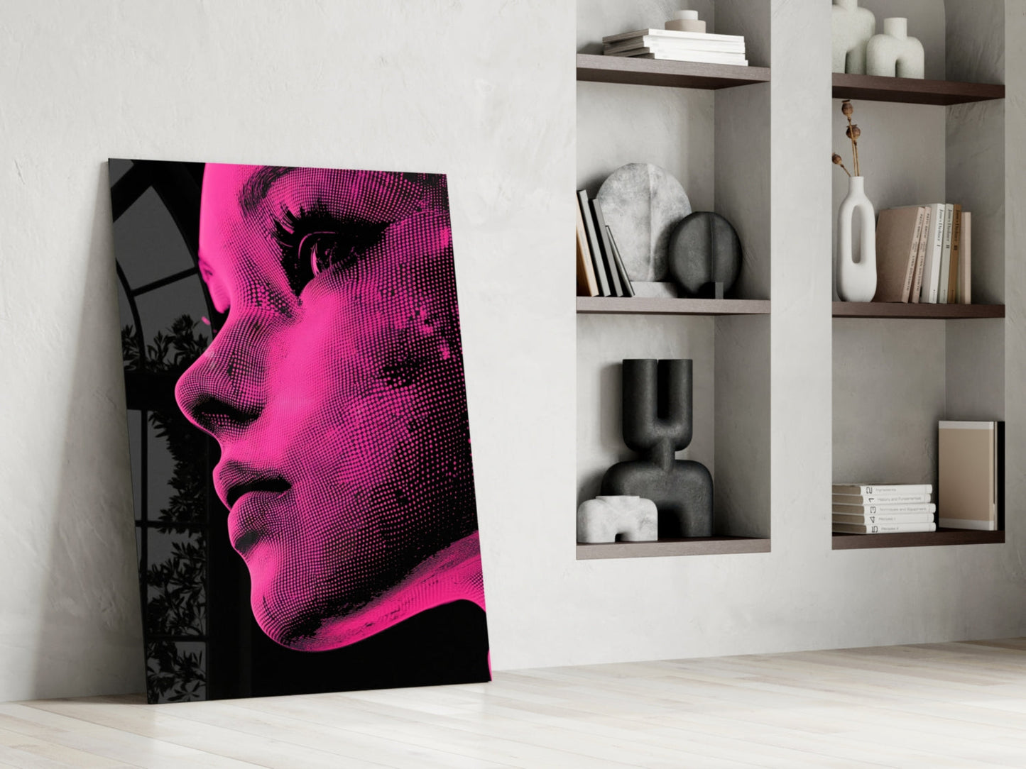 Bold pop art portrait in neon pink and black halftone dots leaning against white wall beside built-in shelving.