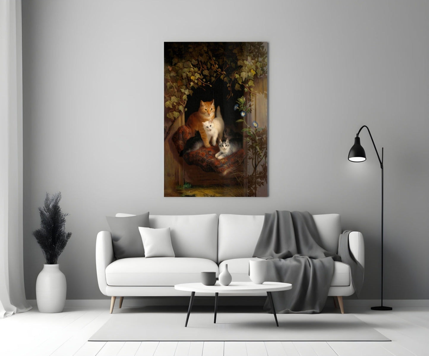 Canvas wall art depicting three cats in warm earth tones displayed above a white sofa in a modern living room.