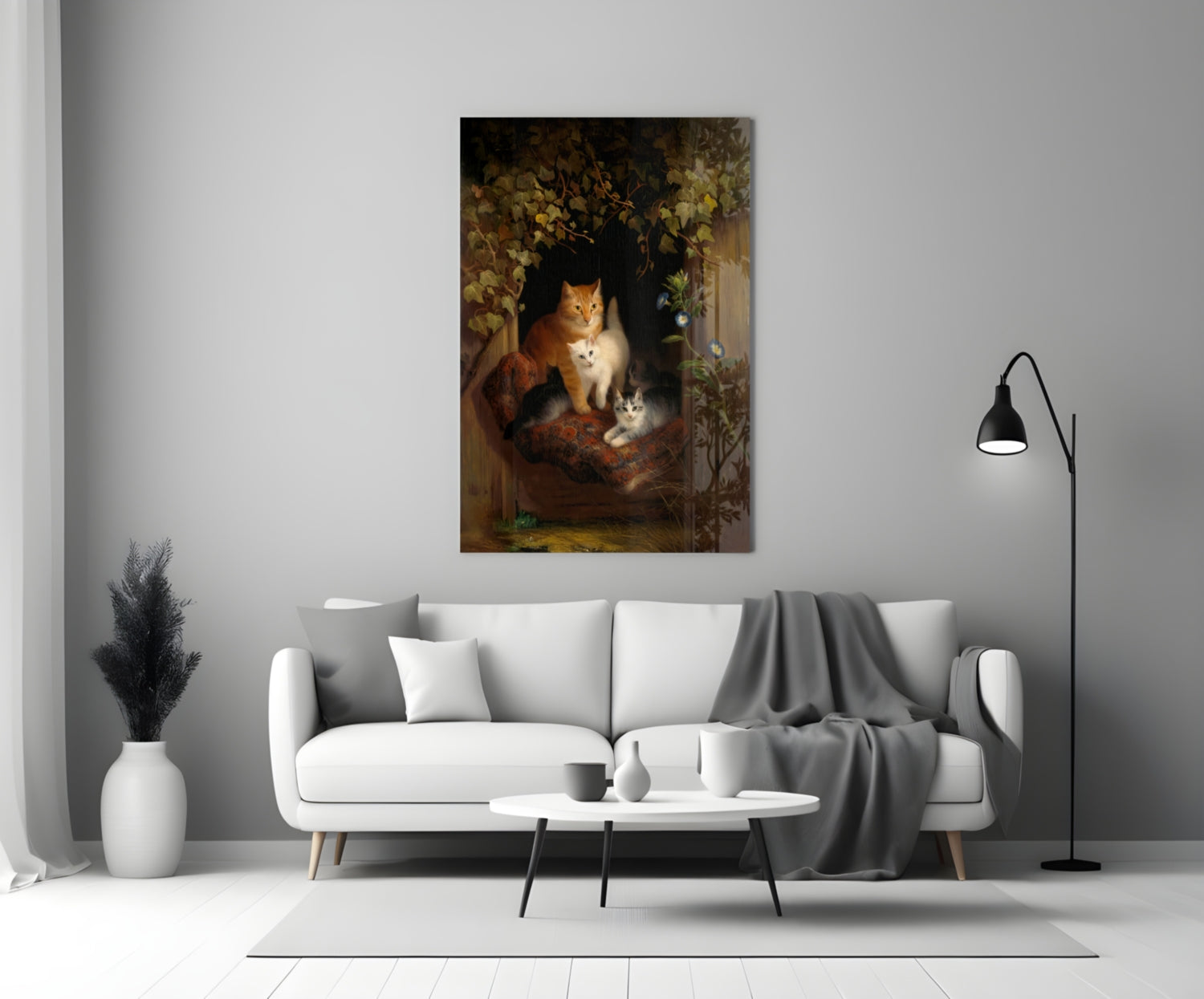 Canvas wall art depicting three cats in warm earth tones displayed above a white sofa in a modern living room.