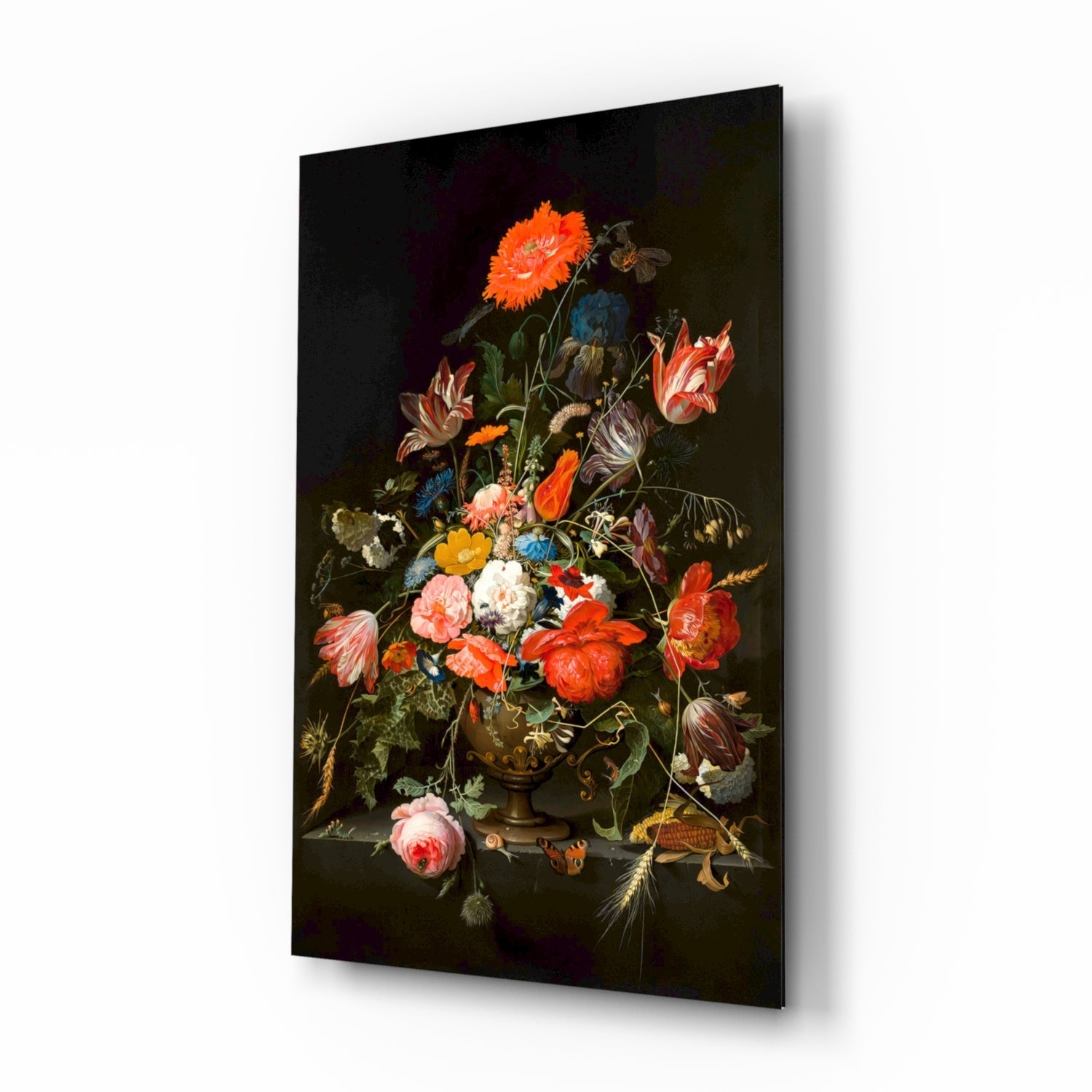 Glass wall art panel displaying a classical floral still life painting with vibrant red, orange, and pink flowers in a bronze vase against a dark background, shown at an angled perspective.