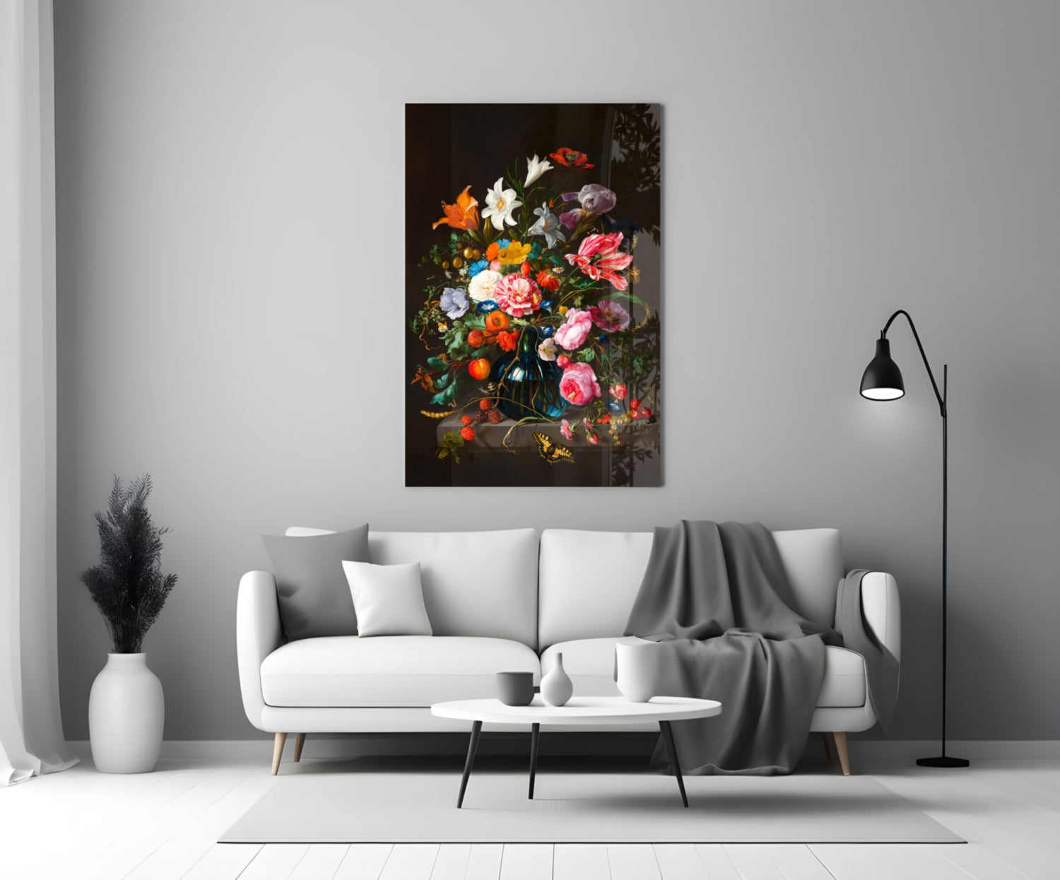 Classical Still Life Glass Wall Art featuring vibrant multicolored flowers in dark ornate vase, displayed above white sofa in modern living room.