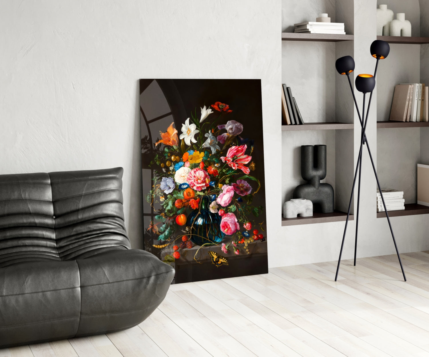 Classical Still Life Glass Wall Art depicting vibrant multicolored flowers in dark vase displayed in modern living room with black sofa and shelving.