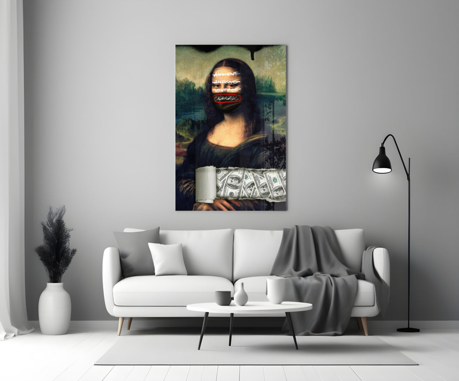 Modern Mona Lisa glass wall art with neon text overlay and dollar bills, displayed above white sofa in minimalist living room.