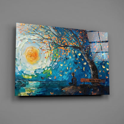 Glass wall art panel displaying impressionist painting of solitary figure under autumn tree with glowing moon and blue water landscape.