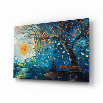 Glass wall art panel featuring an impressionist painting of a solitary figure on a bench beneath a swirling night sky and autumn tree, displayed at an angle.