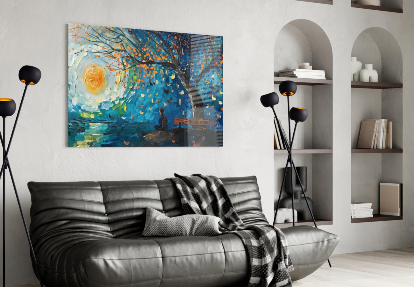 Modern living room with black leather sofa displaying colorful abstract painting featuring swirling blue, yellow, and orange brushstrokes above.