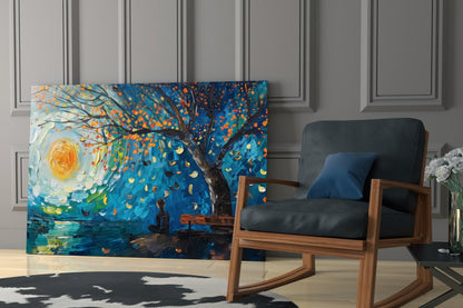 Vibrant glass wall art depicting a figure beneath a swirling tree with orange leaves and glowing moon in blue tones, displayed in modern interior setting beside wooden chair.