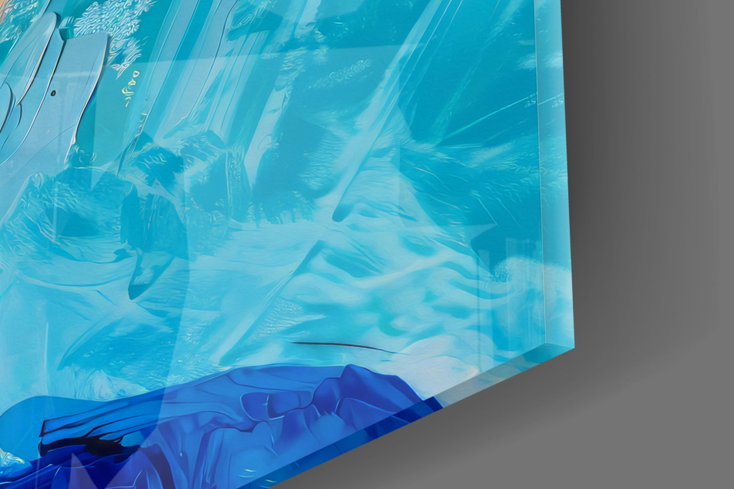 Close-up of layered blue and turquoise glass art showing translucent figure details and etched patterns.