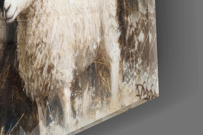Close-up angled view of glass wall art showing textured white and brown brushstrokes with artist signature.