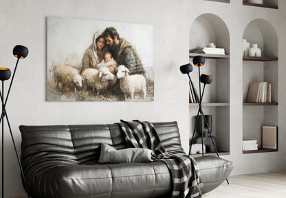 Glass wall art depicting a bearded man, woman, and child with sheep in muted earth tones, displayed above a black leather sofa in a modern living room.