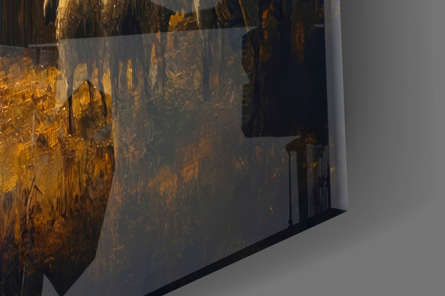 Close-up angled view of textured gold and dark amber glass wall art panel with layered translucent surface against white wall.