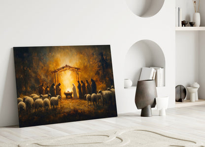Nativity scene glass wall art leaning against white wall beside ceramic decorative objects and shelving.