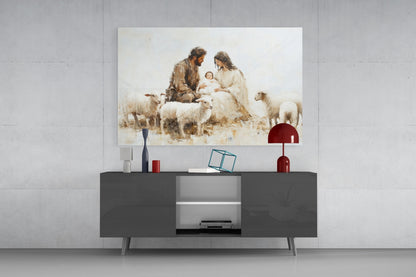 Glass wall art depicting nativity scene with man, woman, infant and sheep displayed above dark media console in modern interior.