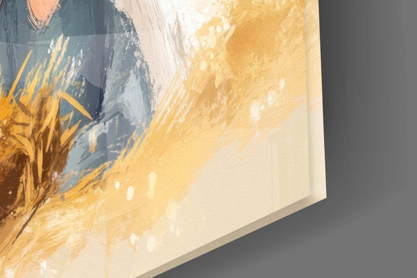 Close-up angled view of glass wall art showing painted figure with gold wheat, blue clothing, and white highlights against cream background.