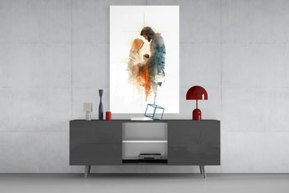 Holy Family Glass Wall Art displayed above gray media console, showing watercolor figures in warm and cool tones with cross symbol.
