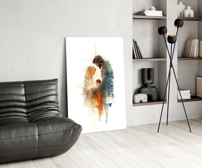 Holy Family glass wall art displayed in modern living room with black leather chair, shelving unit, and floor lamp.