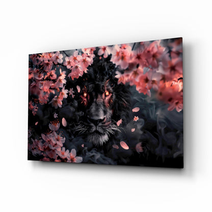 Black lion surrounded by pink blossoms on glass wall art displayed at an angle against white background.