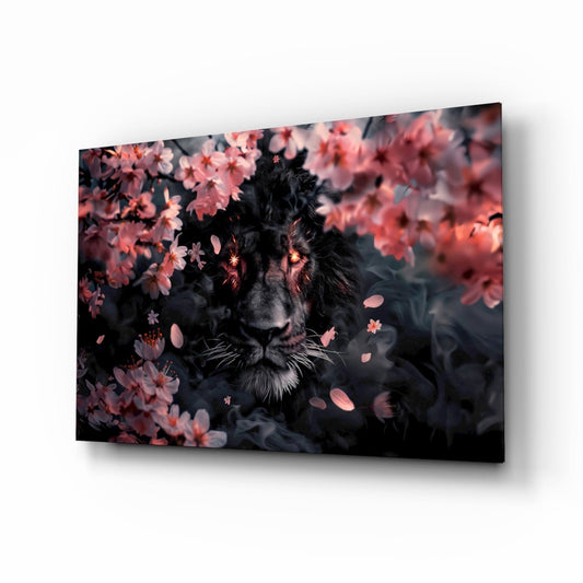 Black lion surrounded by pink blossoms on glass wall art displayed at an angle against white background.