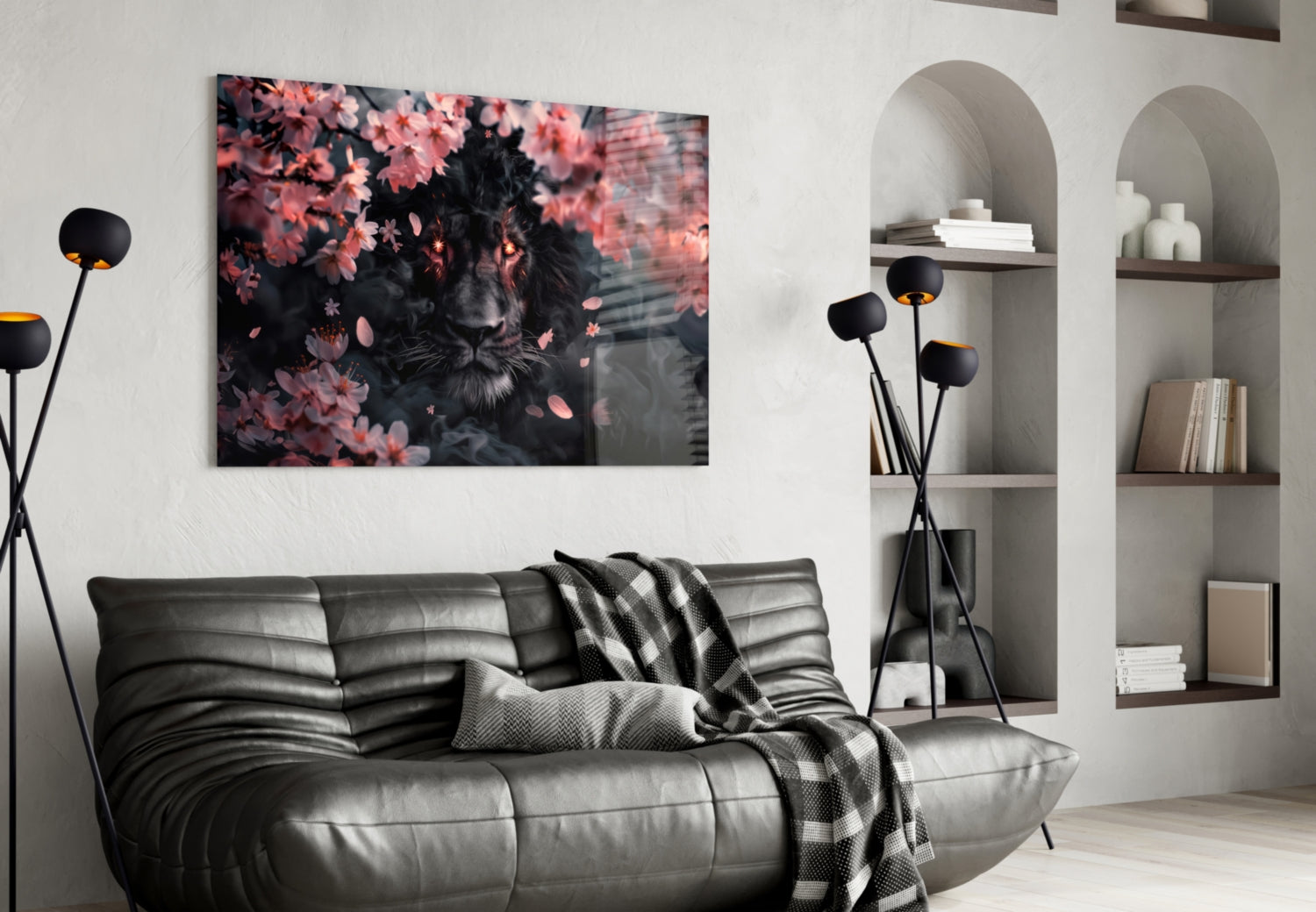 Black leather sofa in modern living room with Lion of the Night glass wall art displaying pink flowers and dark lion face above.