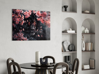 Black lion portrait surrounded by pink flowers displayed on white wall above round black dining table with gray chairs.