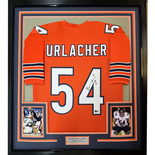 Framed orange Chicago Bears jersey, back view, with white and navy URLACHER lettering, number 54, and a black ink signature.
