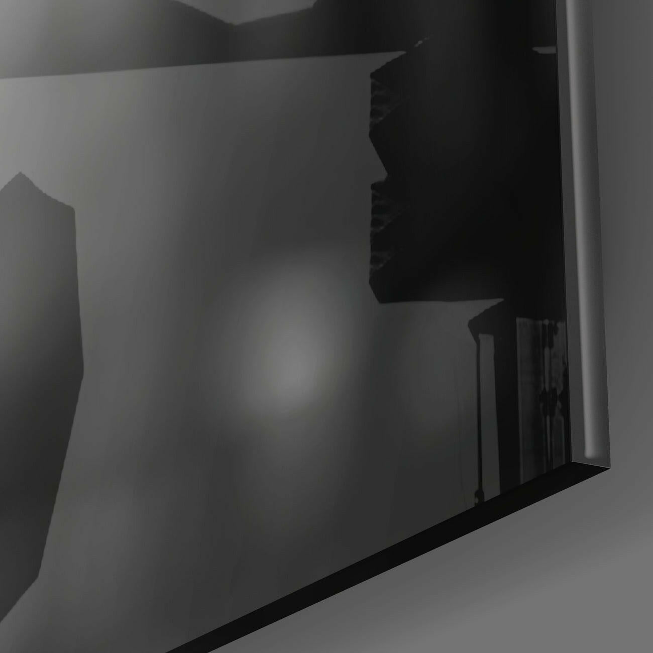 Side angle view of black silhouette warrior figure etched on frosted glass panel against white background.