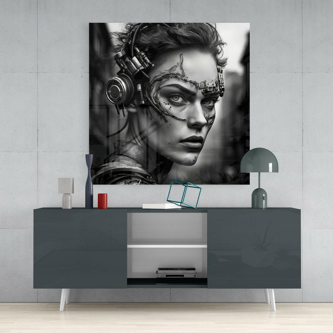 Black and white glass wall art of a cybernetic woman with headphones displayed above a dark console table in a modern interior setting.