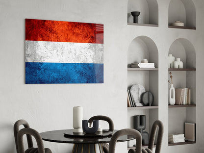 Dutch flag glass wall art with red, white, and blue horizontal stripes displayed above a dining table in a modern interior setting.