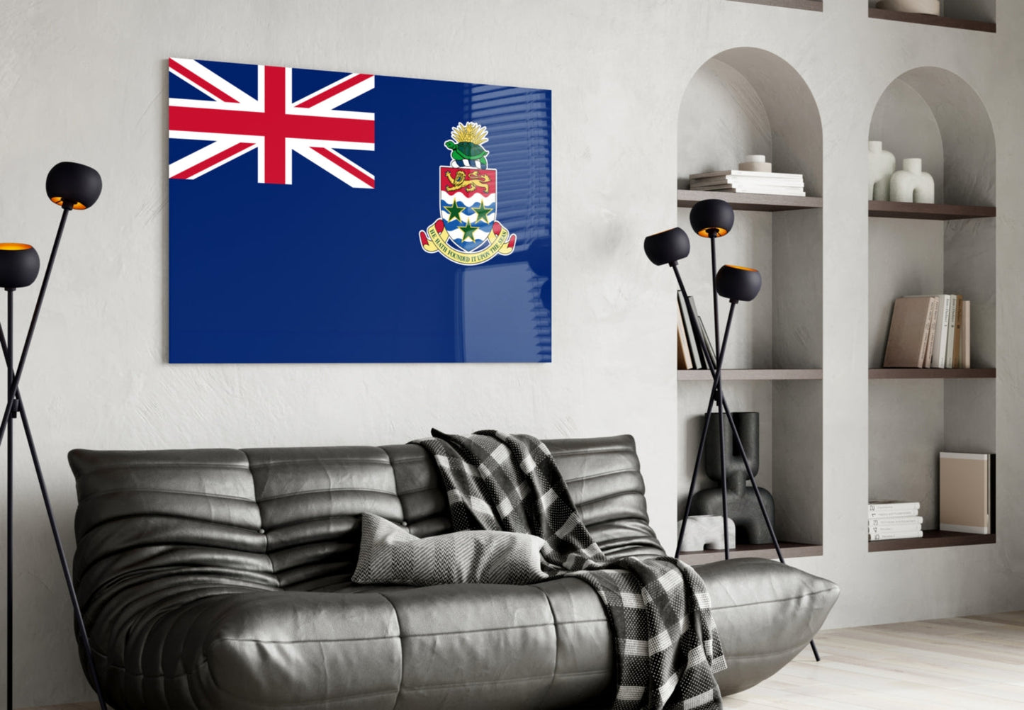 Cayman Islands flag glass wall art displayed above black leather sofa in modern living room with shelving and decor.