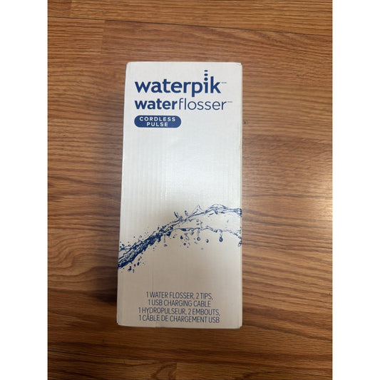 Waterpik Cordless Pulse Water Flosser white packaging box on wooden floor, front view showing product name and water splash graphic.