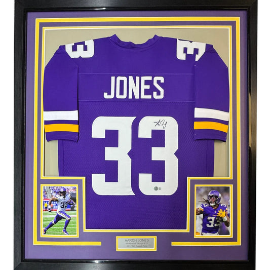 Framed Aaron Jones #33 Minnesota Vikings signed jersey with player photos and engraved plaque