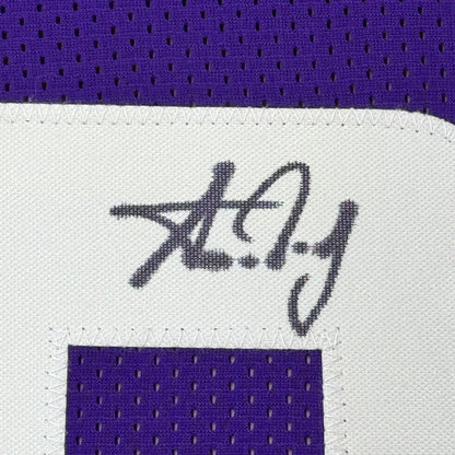 Purple Minnesota Vikings jersey with a white patch and black autograph for Aaron Jones