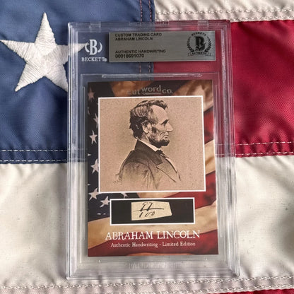 Framed sepia-toned abraham lincoln trading card with authentic lincoln handwriting fragments in clear protective packaging