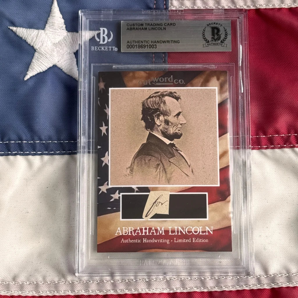 A sepia-toned abraham lincoln legal document card featuring authentic handwriting encased in a clear beckett slab