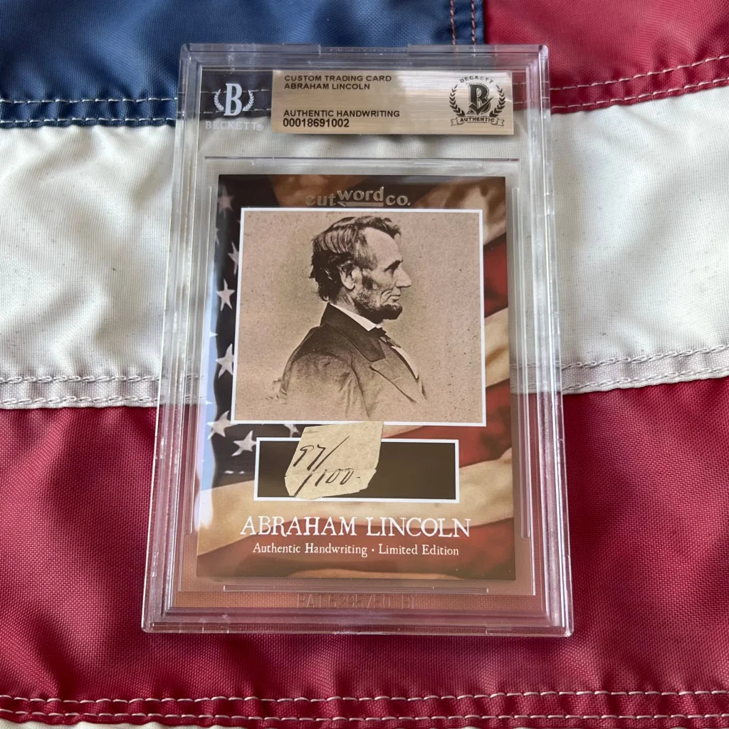 A framed abraham lincoln legal document card featuring lincoln handwriting fragments in a clear bgs slab