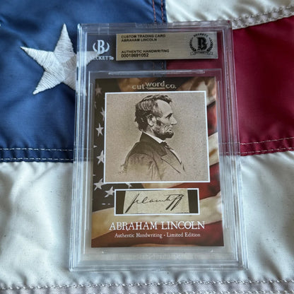 A framed custom trading card with a sepia abraham lincoln portrait and authentic lincoln legal document handwriting fragment