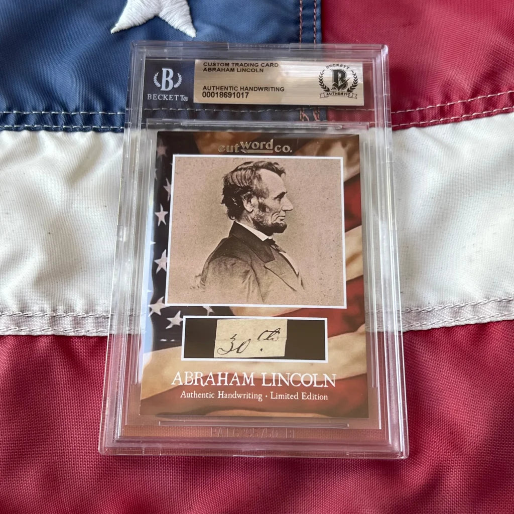 A sepia-toned abraham lincoln legal document card with authentic handwriting encased in a clear beckett slab