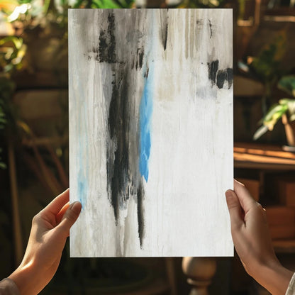 Hands holding bold blue abstract on Insigne aluminum print